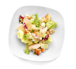 Plate with chicken salad on white background