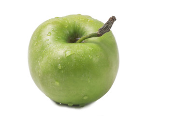 One whole green apple in droplets