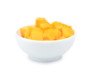 Delicious pieces of cheddar in bowl on white background