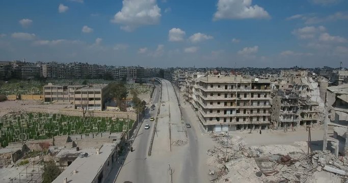 Streets of Aleppo after bombing, in Syria. The city and buildings are ruined after the war - aerial view with a drone - history and war concept	