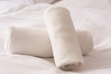 Fototapeta na wymiar Towel in Hotel Room. Two towels on the bed