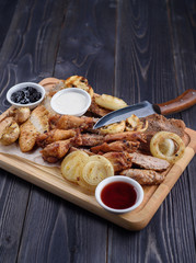 Fried meat on the board