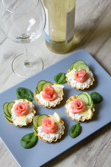 Tartlet with cream cheese, cucumber and slightly salted trout