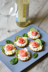 Tartlet with cream cheese, cucumber and slightly salted trout
