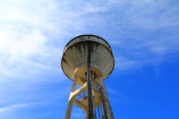 water tank ancient for agriculture on blue sky background