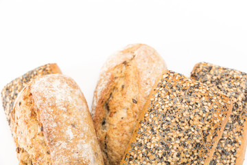 Whole wheat sandwich buns with seeds, on white background.