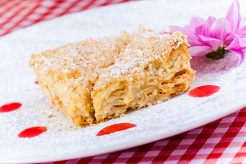 Napoleon cake on white plate