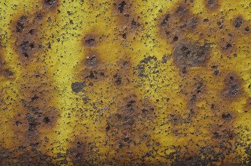 Metallic painted surface with rust and scratched paint