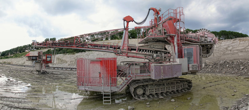 view in a quarry mine with excavator