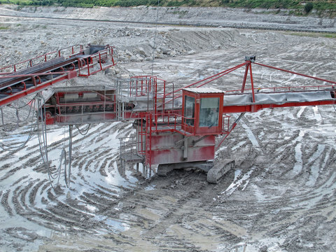 view in a quarry mine with excavator