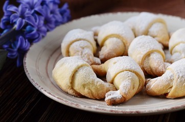 Dessert vanilla croissants with jam and sugar powder 