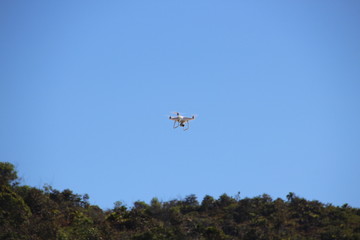 Fototapeta na wymiar Drone flying in the clear sky