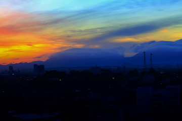Fototapeta na wymiar sunrise in sky beautiful colorful before dawn nature landscape with city silhouette