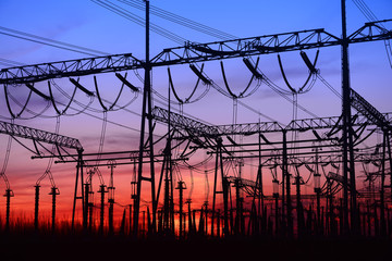 High voltage power grid under the setting sun