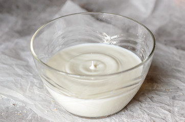 Obraz na płótnie Canvas The milk is poured in a glass dish.