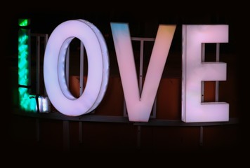 focus blur  love you neon sign at night for background