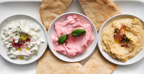 restaurant starter meal of a sharing platter of dips with bread