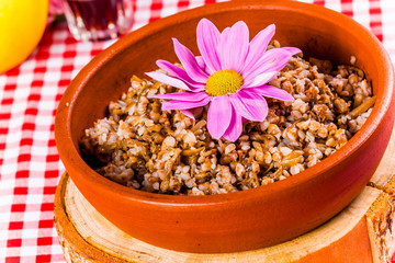 Buckwheat porridge in clay bowl