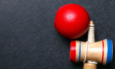 Kendama traditional Japanese toy represent the toy game performed by juggling the ball between the cups balancing in various positions.