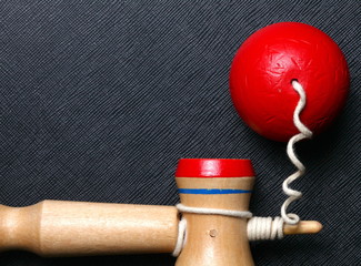 Kendama traditional Japanese toy represent the toy game performed by juggling the ball between the cups balancing in various positions.