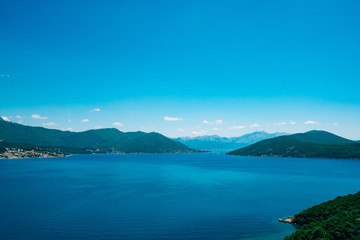 Herceg Novi, the view from the shore on the contrary, against the background of mountains and sky, Montenegro, Adriatic