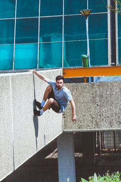 young man doing parkour in the city