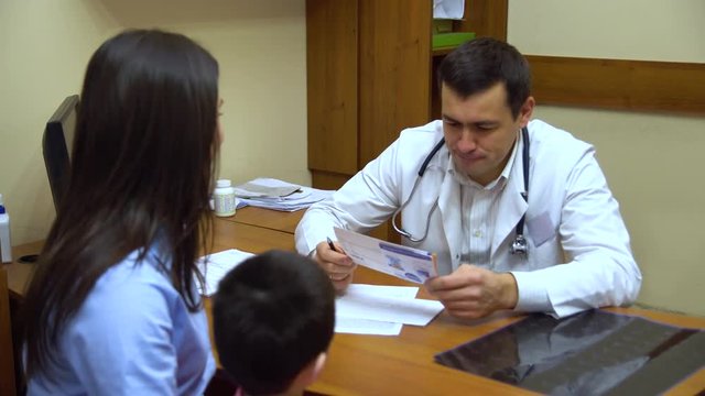 A young mother with a child to the doctor.