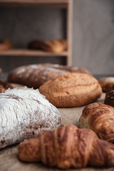 Pastries and bread with flour on table