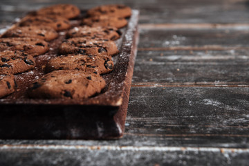 Cookies on desk on dark wooden table