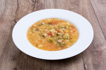 Vegetable soup on a wooden table