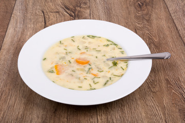 Vegetable soup on a wooden table