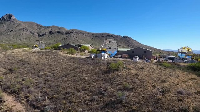 Aerial view of an array of telescopes at an observatory complex