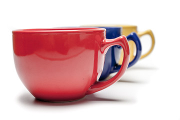 colorful cup with selective focus over white background