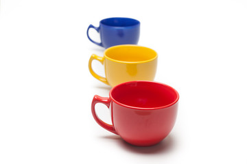 colorful cup with selective focus over white background