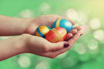 Female hands with Easter eggs.