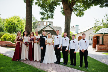Elegance wedding couple with bridesmaids and best mans. Crowd of friends on wedding. Ten people.