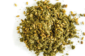 Dry hyssop leaves and seeds heap isolated on white. Food background. Closeup macro shot. Top view.