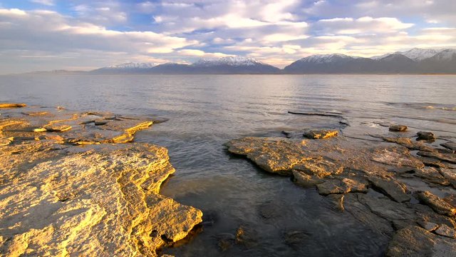 View of Utah Lake at dawn looking across the water towards the mountains