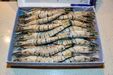 Giant raw frozen tiger shrimps with heads
