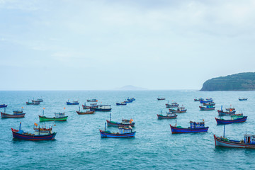 Group of fish boats on sea.