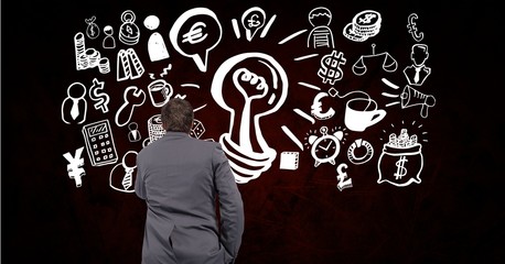 Rear view of businessman with creative business signs