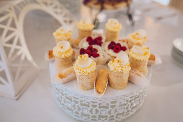 Candy bar on wedding ceremony with a lot of different candies and beverages