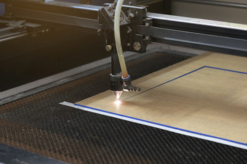 cutting machine carving patterns on the plastic plate