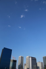Fototapeta na wymiar High-rise buildings and blue sky - .Osaka Business Park, Osaka, Japan