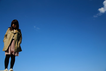 young woman blue sky.