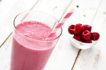 Raspberry smoothie on wooden table

