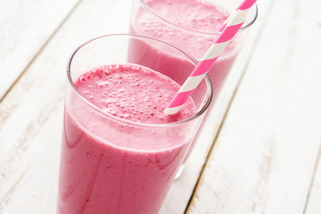 Raspberry smoothie on wooden table

