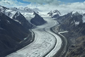 Foto auf Acrylglas aerial photo of a glacier between mountains in alaska © Christian