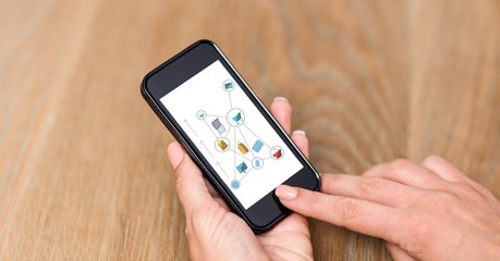 Hand using smart phones with icons on screen