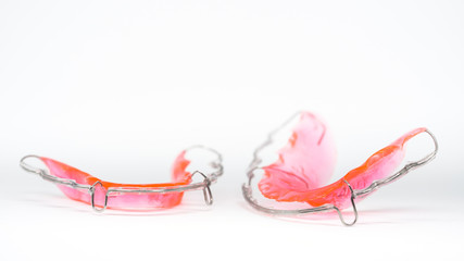 Closeup of removable retainer on gray background - obrazy, fototapety, plakaty